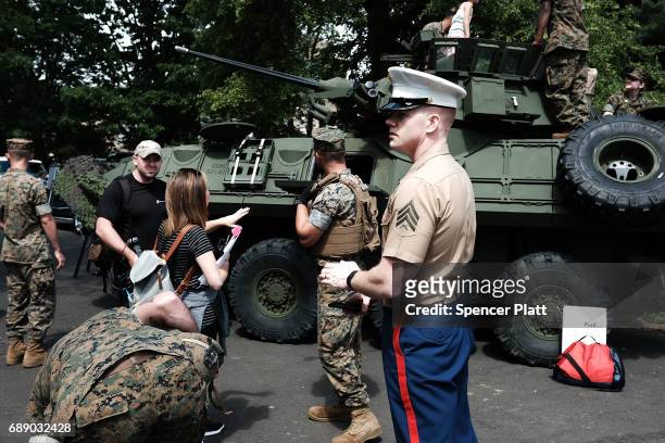 Members of the U.S. Marine Corps mix with the public as they give tours of their equipment in Brooklyn's Prospect Park as part of Fleet Week on May...
