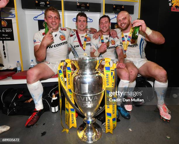 Carl Rimmer of Exeter Chiefs, Ian Whitten of Exeter Chiefs and Will Chudley of Exeter Chiefs pose with the trophy after the Aviva Premiership Final...