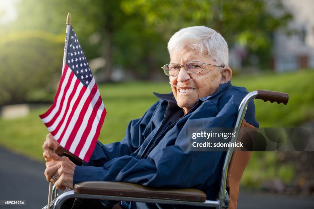 Proud Senior Man Veteran Holing US Flag