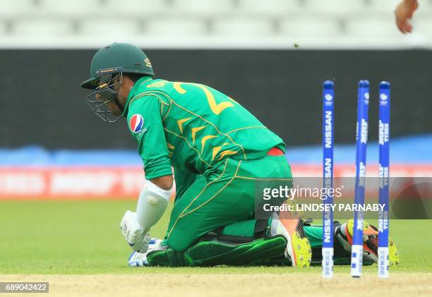 Pakistan batsman Shadab Khan reacts after being run-out by Bangladesh's Mehedi Hasan Miraz during the ICC Champions Trophy Warm-up match between...