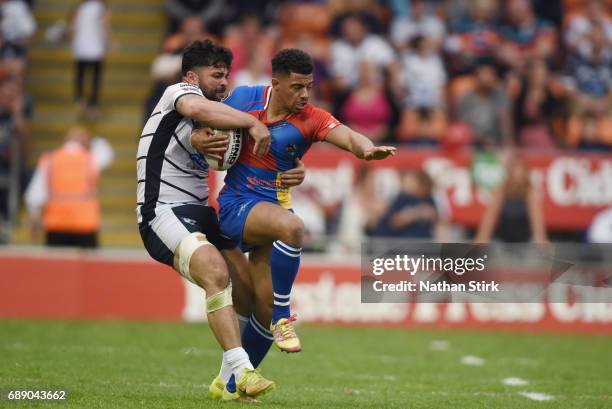 Kieran Dixen of London Broncos and Jason Walton of Featherstone Rovers in action during the Rugby League Summer Bash match between London Broncos and...