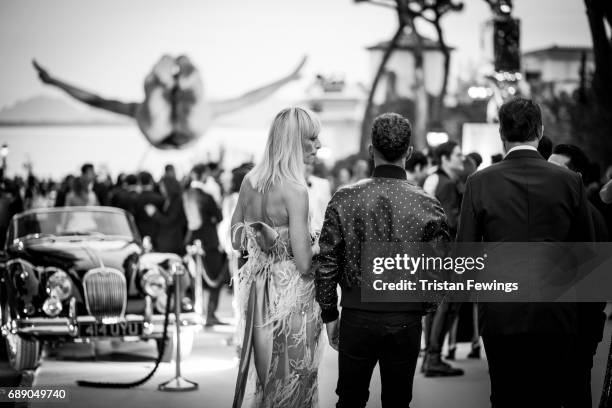 Karolina Kurkova and Lewis Hamilton attend the amfAR Gala Cannes 2017 at Hotel du Cap-Eden-Roc on May 25, 2017 in Cap d'Antibes, France.