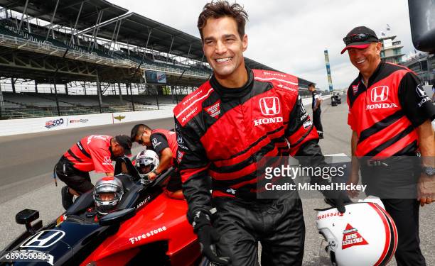 Good Morning America correspondent Rob Marciano reacts after his IndyCar two seater lap at Indianapolis Motor Speedway on May 27, 2017 in...