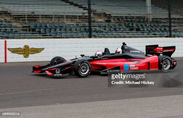 Mario Andretti drives actor Paul Giamatti in a two seater lap at the Indianapolis Motor Speedway on May 27, 2017 in Indianapolis, Indiana.