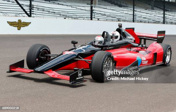 Mario Andretti drives Good Morning America correspondent Rob Marciano in a two seater lap at the Indianapolis Motor Speedway on May 27, 2017 in...