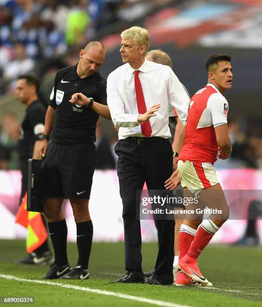 Alexis Sanchez of Arsenal and Arsene Wenger, Manager of Arsenal embrace during the Emirates FA Cup Final between Arsenal and Chelsea at Wembley...