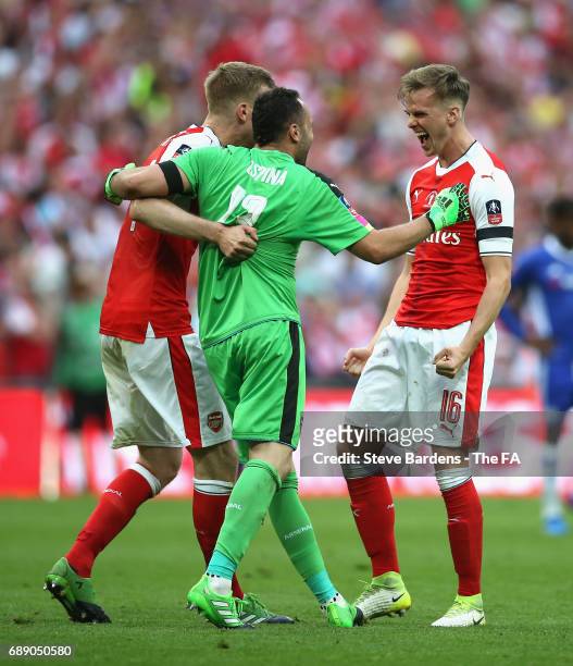 Per Mertesacker of Arsenal , David Ospina of Arsenal and Rob Holding of Arsenal celebrate after the Emirates FA Cup Final between Arsenal and Chelsea...