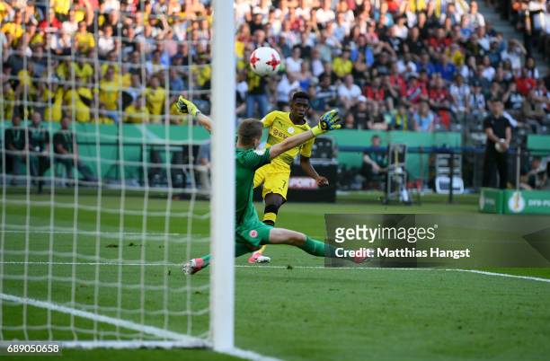 Ousmane Dembele of Dortmund scores his team's first goal past goalkeeper Lukas Hradecky during the DFB Cup Final 2017 between Eintracht Frankfurt and...