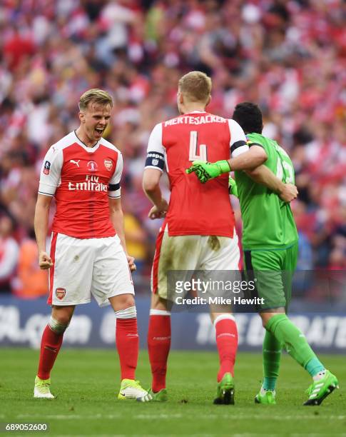 Rob Holding of Arsenal , Per Mertesacker of Arsenal and David Ospina of Arsenal celebrate after The Emirates FA Cup Final between Arsenal and Chelsea...