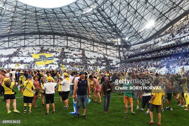 Clermont's supporters invade the pitch after the French Top 14 rugby union semi-final match between Racing 92 and Clermont-Ferrand on May 27, 2017 at...