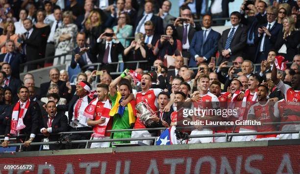 Laurent Koscielny of Arsenal lifts The FA Cup after The Emirates FA Cup Final between Arsenal and Chelsea at Wembley Stadium on May 27, 2017 in...