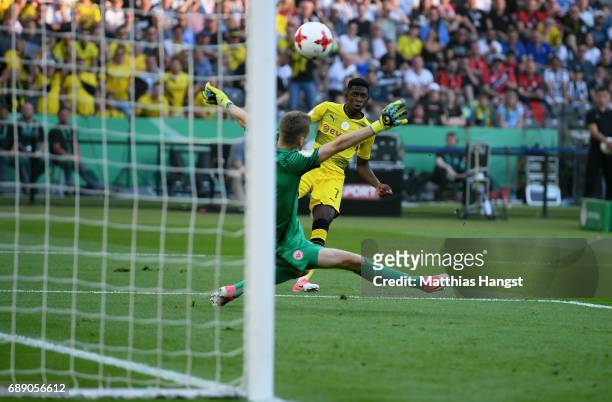 Ousmane Dembele of Dortmund scores his team's first goal past goalkeeper Lukas Hradecky during the DFB Cup Final 2017 between Eintracht Frankfurt and...