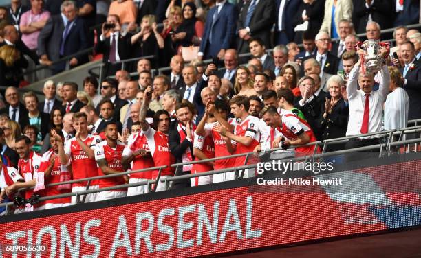 Arsene Wenger, Manager of Arsenal lifts The FA Cup after The Emirates FA Cup Final between Arsenal and Chelsea at Wembley Stadium on May 27, 2017 in...