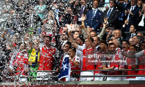 Laurent Koscielny of Arsenal lifts The FA Cup after The Emirates FA Cup Final between Arsenal and Chelsea at Wembley Stadium on May 27, 2017 in...