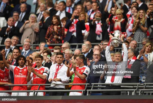 Arsene Wenger, Manager of Arsenal lifts The FA Cup after The Emirates FA Cup Final between Arsenal and Chelsea at Wembley Stadium on May 27, 2017 in...