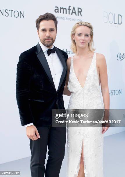 Diego Bivero-Volpe and Charlotte Carroll arrive at the amfAR Gala Cannes 2017 at Hotel du Cap-Eden-Roc on May 25, 2017 in Cap d'Antibes, France.