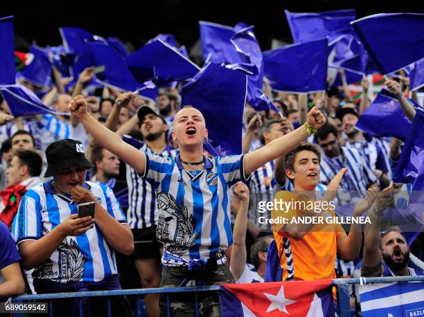 Alaves' supporters cheer their team before the Spanish Copa del Rey final football match FC Barcelona vs Deportivo Alaves at the Vicente Calderon...