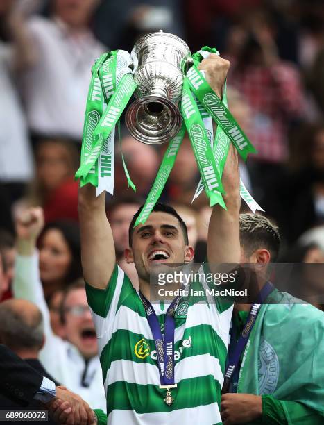 Tom Rogic of Celtic lifts the trophy during the William Hill Scottish Cup Final between Celtic and Aberdeen at Hampden Park on May 27, 2017 in...