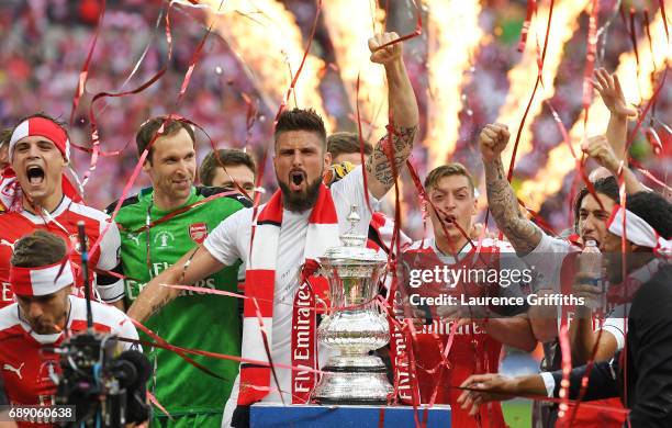 Olivier Giroud of Arsenal celebrates with the trophy after The Emirates FA Cup Final between Arsenal and Chelsea at Wembley Stadium on May 27, 2017...