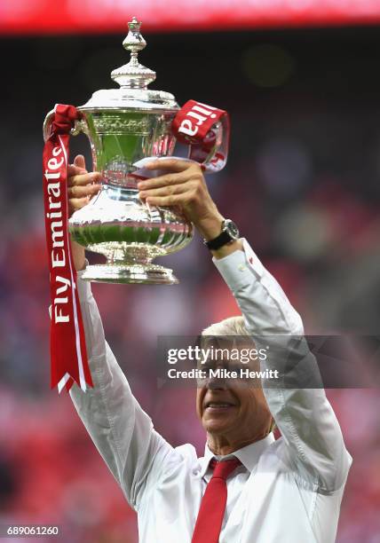 Arsene Wenger, Manager of Arsenal celebrates with The FA Cup after The Emirates FA Cup Final between Arsenal and Chelsea at Wembley Stadium on May...