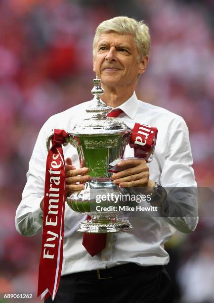 Arsene Wenger, Manager of Arsenal celebrates with The FA Cup after The Emirates FA Cup Final between Arsenal and Chelsea at Wembley Stadium on May...