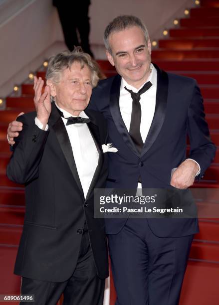 Director Roman Polanski and Olivier Assayas leave the "Based On A True Story" screening during the 70th annual Cannes Film Festival at Palais des...
