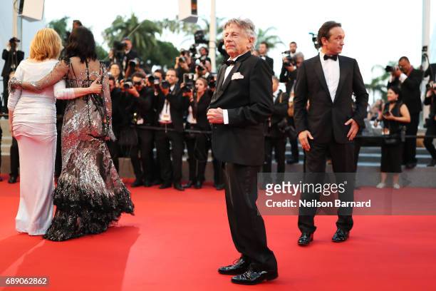 Emmanuelle Seigne, Eva Green, Director Roman Polanski, and Vincent Perez leave the "Based On A True Story" screening during the 70th annual Cannes...