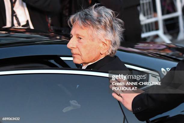 French-Polish director Roman Polanski gets into a car as he leaves the Festival Palace on May 27, 2017 following the screening of the film 'Based on...