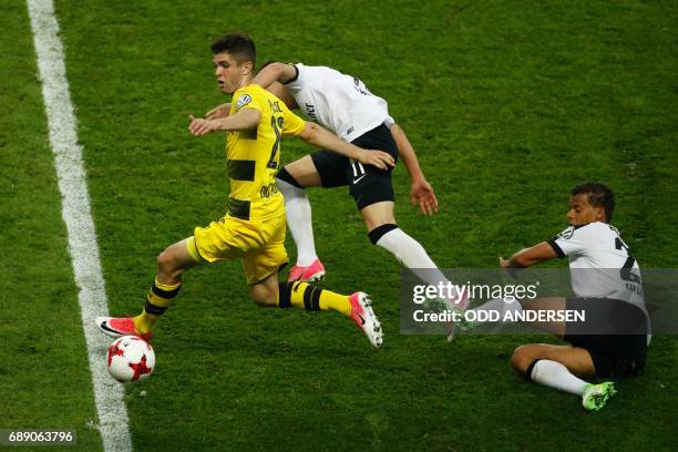 Dortmund's US midfielder Christian Pulisic runs with the ball during the German Cup final football match Eintracht Frankfurt v BVB Borussia Dortmund...