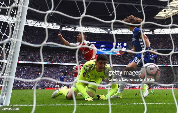 Aaron Ramsey of Arsenal celebrates scoring his sides second goal past Thibaut Courtois of Chelsea during The Emirates FA Cup Final between Arsenal...