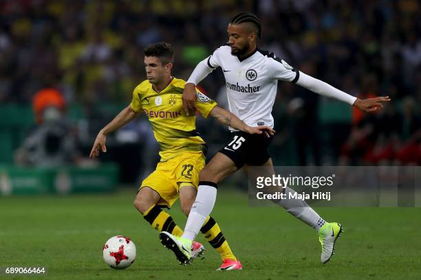 Christian Pulisic of Dortmund is challenged by Michael Hector of Frankfurt during the DFB Cup final match between Eintracht Frankfurt and Borussia...