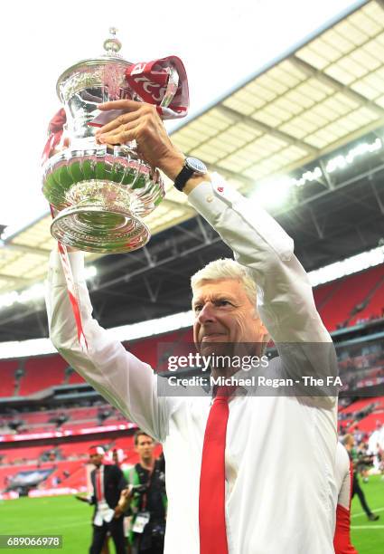 Arsene Wenger, Manager of Arsenal celebrates with The FA Cup after the Emirates FA Cup Final between Arsenal and Chelsea at Wembley Stadium on May...