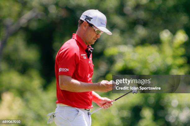 Zach Johnson looks at his ball as he walks off the 8th green during the second round of the Dean & Deluca Invitational on May 26, 2017 at Colonial...