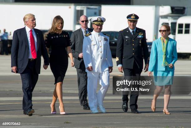 In this handout provided by U.S. Navy, Capt. Brent Trickel, commanding officer of Naval Air Station Sigonella, Col. Federico Fedele, Italian base...