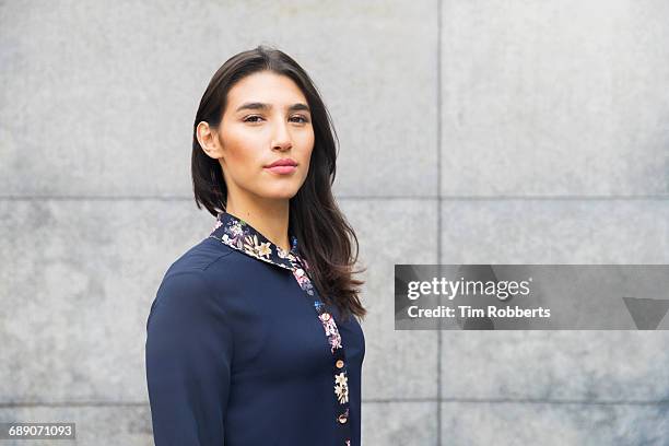 portrait of woman looking at camera - strong women stock pictures, royalty-free photos & images