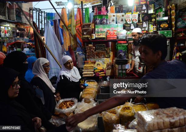 Indian muslims buy dates on the first day of holy month of Ramadan ,at a street market , in Allahabad on May 27,2017.