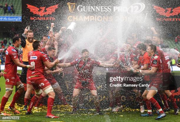 Dublin , Ireland - 27 May 2017; Scarlets' James Davies is sprayed with champagne by teammates following their victory in the Guinness PRO12 Final...