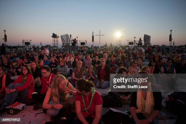 Pilgrims attend the "Night of the lights" at the Elbe meadows on May 27, 2017 in Wittenberg, Germany. Up to 200,000 faithful are expected to attend...