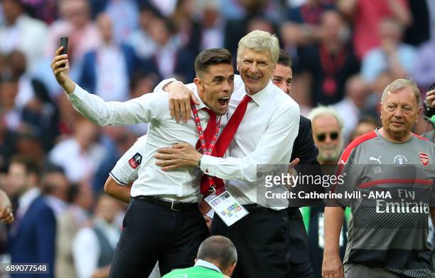 Gabriel Paulista of Arsenal celebrates with Arsene Wenger manager / head coach of Arsenal after the Emirates FA Cup Final match between Arsenal and...