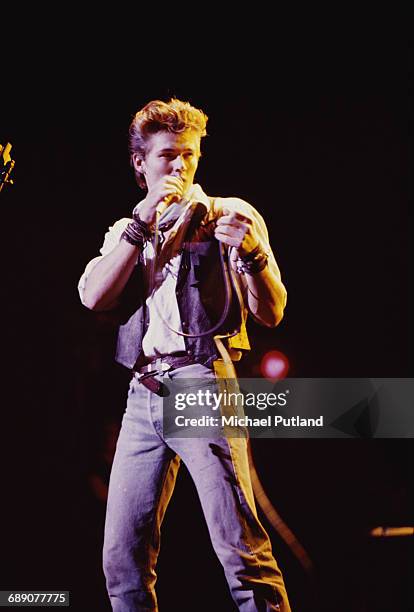 Singer Morten Harket performing with Norwegian pop group A-ha, UK, circa 1987.