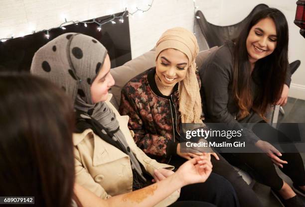 #muslimgirls iftar for ramadan - showing off henna - muslimgirlcollection ストックフォトと画像