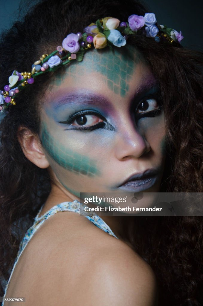 Woman's portrait wearing fantasy makeup.