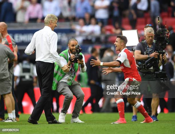 Arsene Wenger the Manager celebrates with Alexis Sanchez after the match between Arsenal and Chelsea at Wembley Stadium on May 27, 2017 in London,...