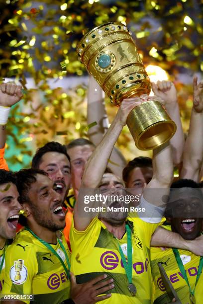 Team captain Marcel Schmelzer of Dortmund lifts the trophy after winning the DFB Cup Final 2017 between Eintracht Frankfurt and Borussia Dortmund at...