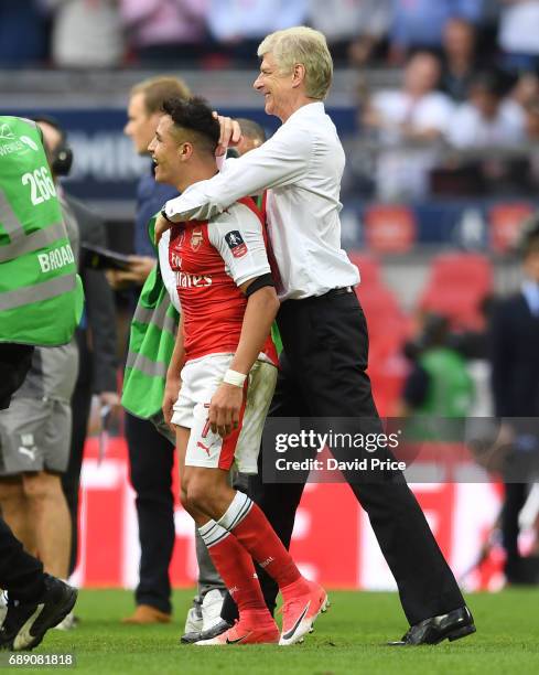 Arsene Wenger the Manager celebrates with Alexis Sanchez after the match between Arsenal and Chelsea at Wembley Stadium on May 27, 2017 in London,...