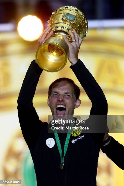 Head coach of Dortmund Thomas Tuchel lifts the trophy after winning the DFB Cup Final 2017 between Eintracht Frankfurt and Borussia Dortmund at...