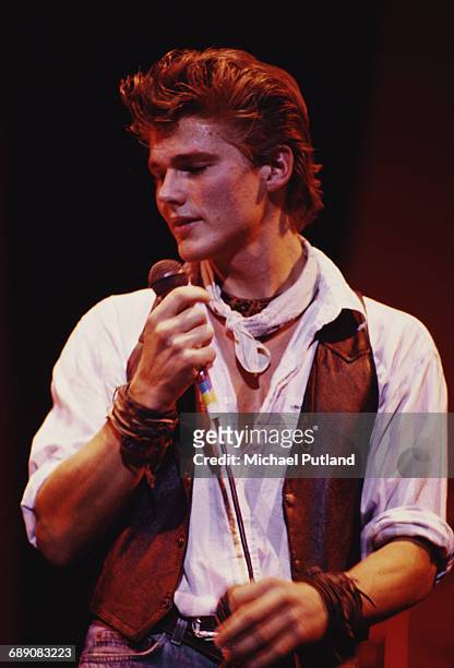 Singer Morten Harket performing with Norwegian pop group A-ha, UK, circa 1987.