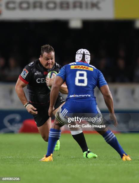 Nizaam Carr of the DHL Stormers looks to tackle Coenie Oosthuizen of the Cell C Sharks during the Super Rugby match between Cell C Sharks and DHL...