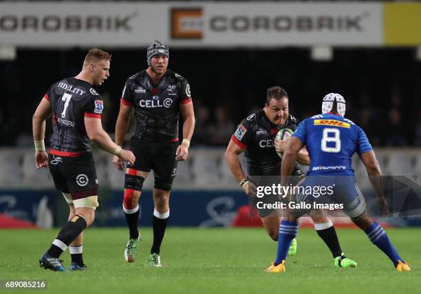 Nizaam Carr of the DHL Stormers looks to tackle Coenie Oosthuizen of the Cell C Sharks during the Super Rugby match between Cell C Sharks and DHL...