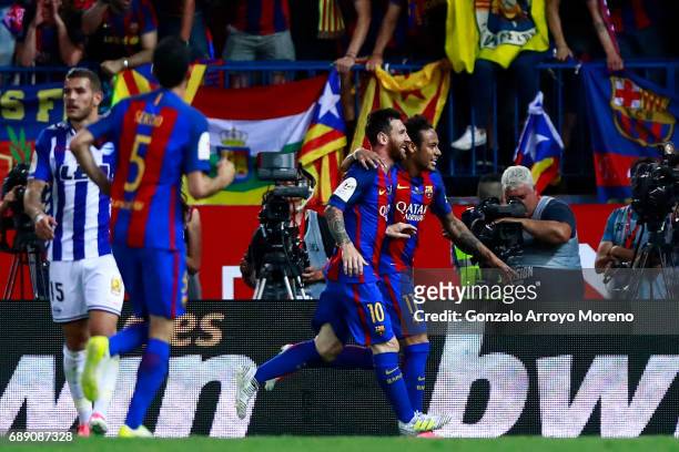 Lionel Messi and Neymar JR. Of FC Barcelona celebrates their third goal during the Copa Del Rey Final between FC Barcelona and Deportivo Alaves at...